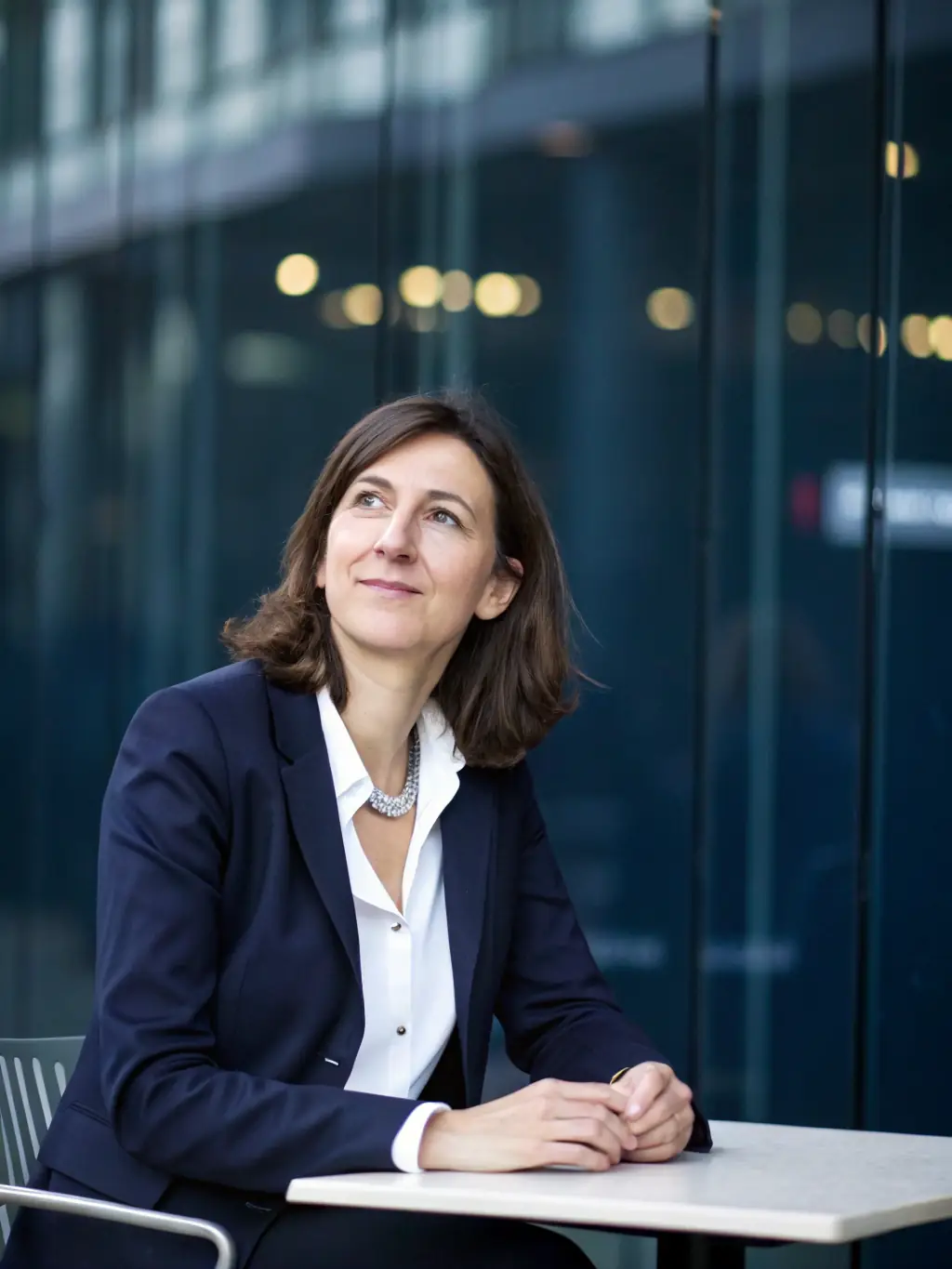 A professional headshot of a union representative offering legal advice to a member in a modern office setting.